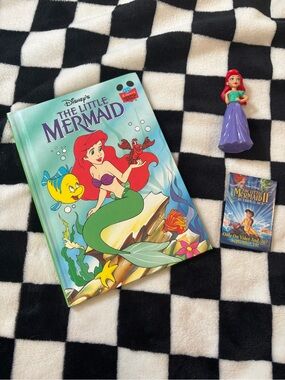 The little mermaid book figure and pin (crayon in front cover of book)